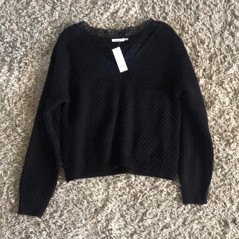 Francesca’s black sweater